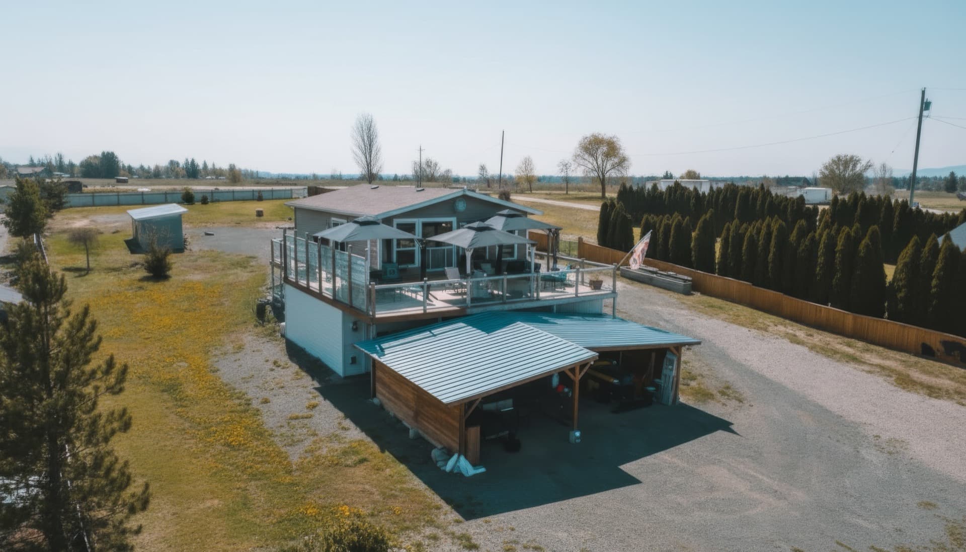 3710 Louis Creek Road - Aerial view of home with massive deck